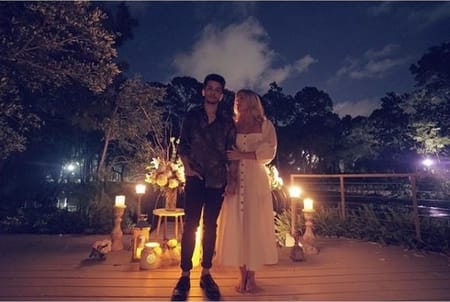 Jordan Fisher and his fiance Ellie Woods at their parents beach house after the engagement